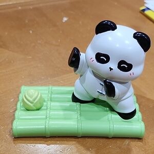Phone Stand Panda Toy on Green Bamboo Mat